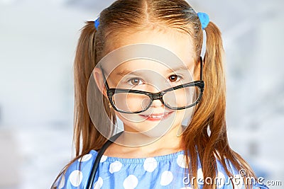 Funny smiling child girl in glasses Stock Photo