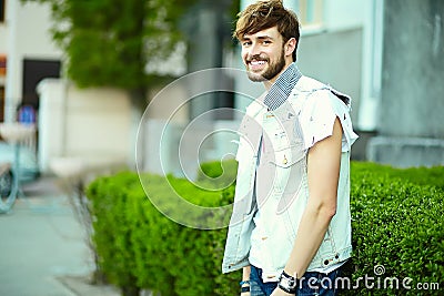 Funny smiling hipster handsome man in hipster cloth in the street Stock Photo