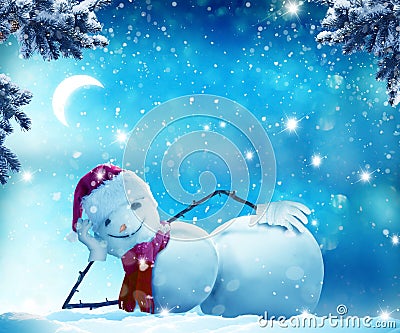 Funny snowman lying in the snow Stock Photo