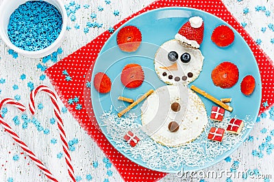 Funny snowman pancake for breakfast - Christmas and New Year fun Stock Photo