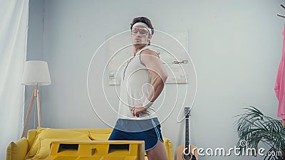 funny sportsman with hands on hips Stock Photo