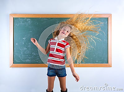 Funny student girl flipping long hair at school Stock Photo