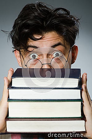 Funny student with many books Stock Photo