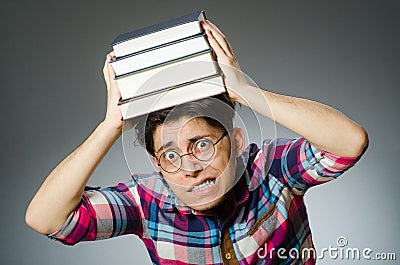 Funny student with many books Stock Photo