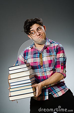 Funny student with many books Stock Photo