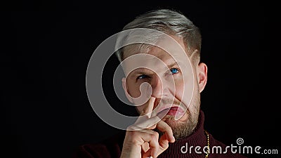 Funny stupid stylish man picking nose, removing boogers, uncultured habit, bad manners Stock Photo