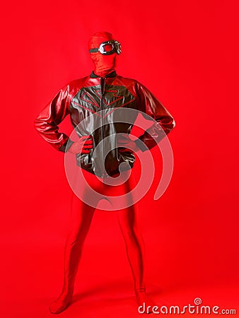 A funny super hero in a red leotard and protective glasses Stock Photo