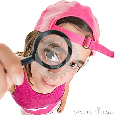 Funny teenage girl looking through a magnifying glass Stock Photo