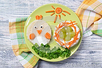 Funny toast in a shape of chick and nest with eggs, sandwich for kids Easter idea, top view Stock Photo