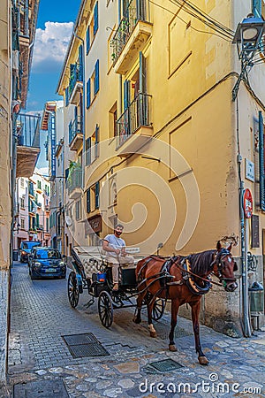 Funny traffic on one narrow street from Palma de Mallorca, Balearic islands, Spain Editorial Stock Photo