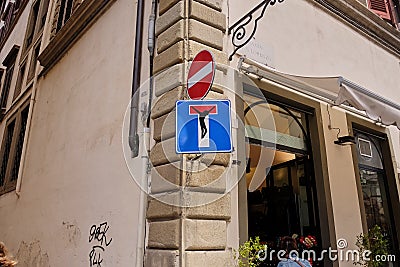 Funny traffic signs, Florence, Italy-March 30, 2018: No Entry and Dead End street signs in streets of Florence were animated by a Stock Photo