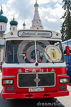 Yaroslavl, Russia, July 4, 2023. Vintage tourist bus on the background of an ancient temple. Editorial Stock Photo