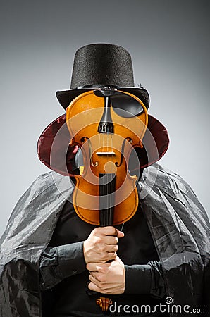 The funny violin player wearing tophat Stock Photo