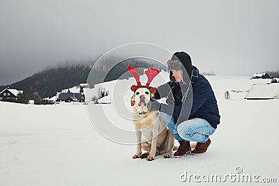 Funny walk with dog in the snowy landscape Stock Photo