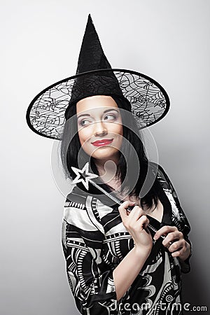 Funny Witch. Young happy woman with canival hat. Stock Photo