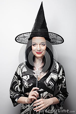 Funny Witch. Young happy woman with canival hat. Stock Photo