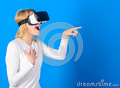 Funny woman experiencing 3D gadget technology - close up. Excited smiling businesswoman wearing virtual reality glasses Stock Photo