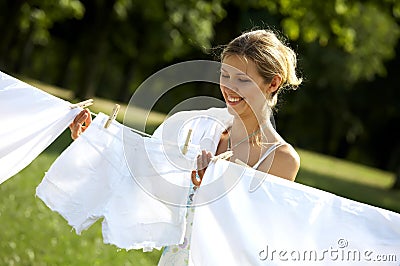 Funny woman hanging clothes Stock Photo