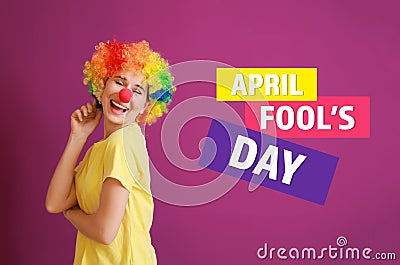Funny woman with party decor for April Fools\' Day on color background Stock Photo