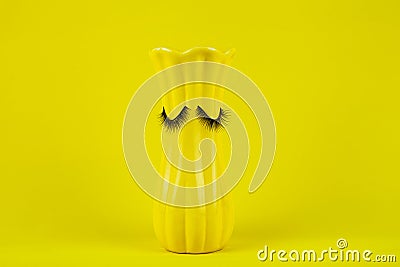 Funny yellow vase with eyes Stock Photo