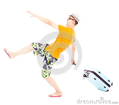 Funny young backpacker pulling a baggage to travel worldwide Stock Photo
