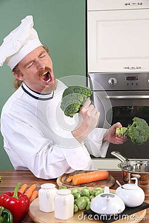 Funny young Chef with broccoli Stock Photo