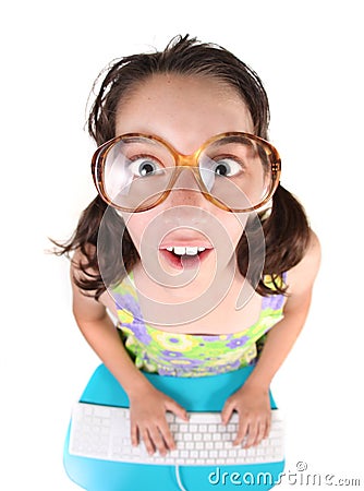 Funny Young Child Working on a Computer Stock Photo