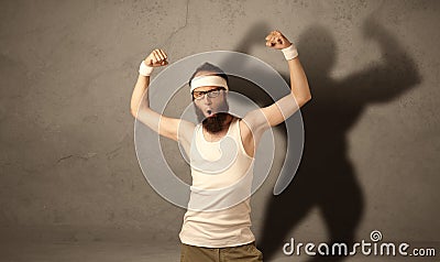 Skinny man with musculous shadow Stock Photo