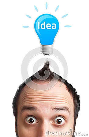 Funny young man with light bulb over his head Stock Photo