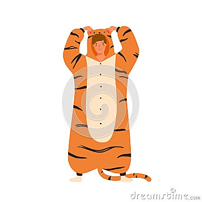 Funny young man wearing tiger kigurumi for pagama party. Male character standing in animal costume. Cheerful guy in cozy Vector Illustration
