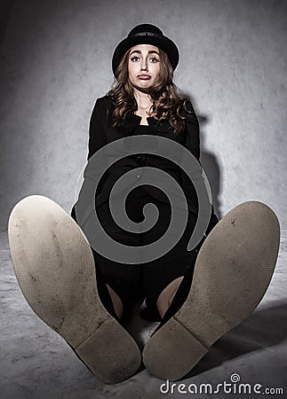 Funny young woman in a black costume Stock Photo