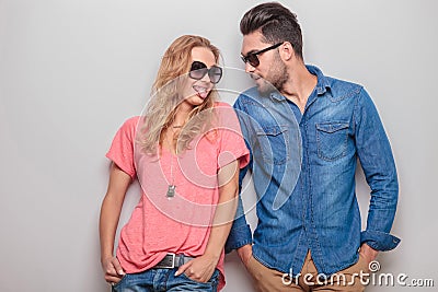 Funny young woman showing her boyfriend her tongue Stock Photo