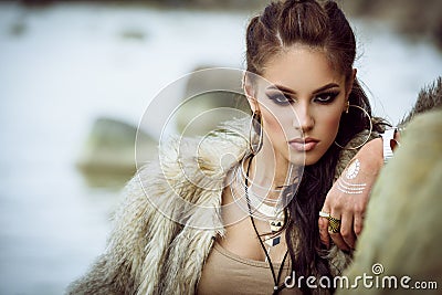 Fur coat and flash tattoos Stock Photo