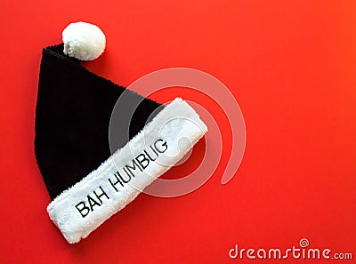 Fur hat saying Bah Humbug on a red background Stock Photo