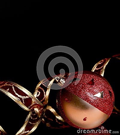 Fur-tree sphere with ornamental tape on a black Stock Photo