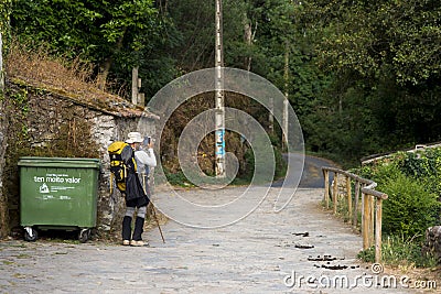A pilgrim with backpack and wooden stick Editorial Stock Photo