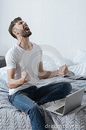 Furious angry man holding crumpled paper Stock Photo