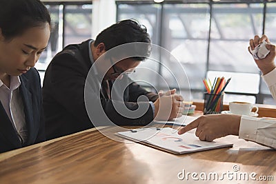 Furious boss scolding frustrated woman at office. irritated man Stock Photo