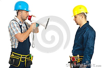 Furious boss shouting megaphone to employee Stock Photo