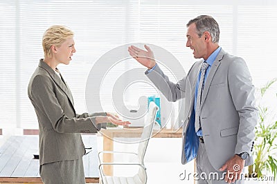 Furious boss yelling at colleague Stock Photo