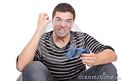 Furious man with a joystick for game console Stock Photo