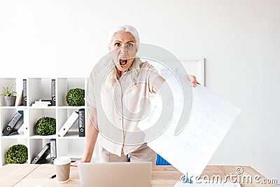 Furious mature business woman Stock Photo