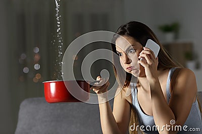 Furious woman claiming insurance for water leaks Stock Photo