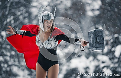 Furious woman in image of Germanic-Scandinavian God of thunder and storm. Cosplay. Stock Photo