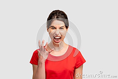 Furious woman portrait feeling rage mad screaming Stock Photo