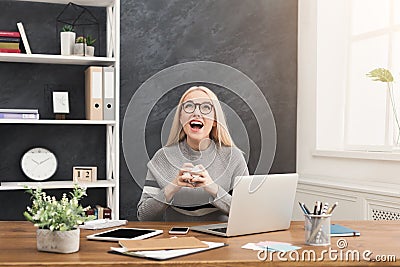 Furious woman working on laptop at office Stock Photo