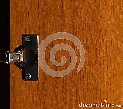 Furniture hinge on door Stock Photo