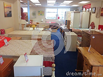 Furniture inside a second hand used charity shop. Editorial Stock Photo