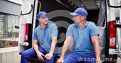 Furniture Removal Men. Relocation Delivery Truck Stock Photo