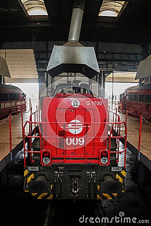 Diesel locomotive belonging to the Kosovo railways, trainkos, a Vossloh, being maintained in the workshop of Fushe Kosove depot. Editorial Stock Photo